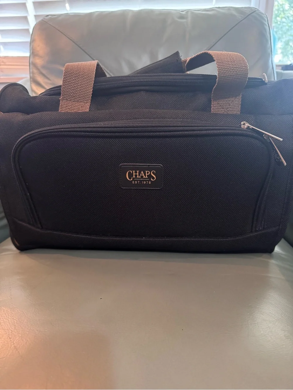 Chaps Black Duffel Bag with Tan Trim shoulder strap and double handle